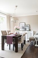 Modern dining room with white piano 