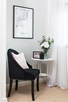 Black chair and white side table 