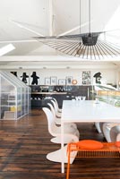 Contemporary open plan industrial kitchen and dining room 