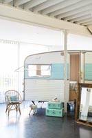 Vintage caravan used as bedroom in industrial home 