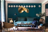 Modern living room with dark blue painted walls 