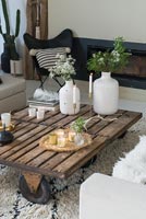 Wooden coffee table with candles at Christmas 