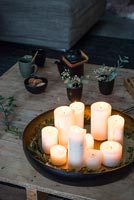 Circular tray of lit candles 