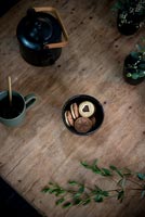 Overhead view of tea and biscuits on coffee table 