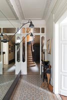Classic hallway with view through interior door to staircase 