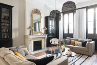 Monochrome modern living room with period details 