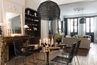 Black and white dining room with candles on table 