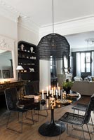 Black and white dining room with wooden floor 