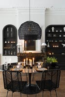Monochrome modern dining room with period details 