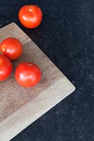 Tomatoes on kitchen surface 