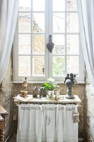 Side table next to window in country house 