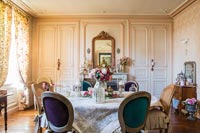 Classic dining room with floral curtains and period details 
