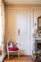 Pink painted paneled doors in classic living room 