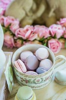 Vintage cup filled with macaroons 