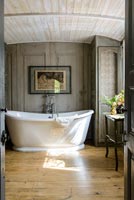 Freestanding bath in elegant classic bathroom 