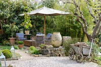 Garden furniture in rustic country garden 