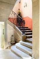 Stone steps and sculptures in classic hallway 