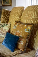 Gold sofa with cushions 