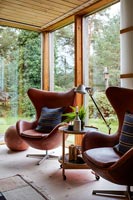 Vintage leather armchairs in modern living room 