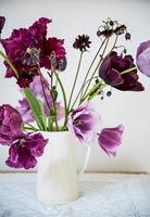 Purple country flowers in jug 
