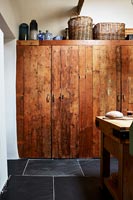 Large wooden cabinet in country kitchen 