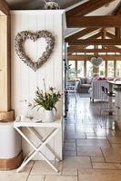 Heart wreath on wooden cabinet in open plan living space 