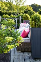 Wooden terrace with garden furniture detail 