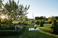 Country garden with sculpture 