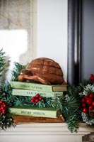 Close up stack of books with ornament 