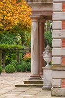 Exterior of columns and urns on porch of country manor house - Morton Hall 