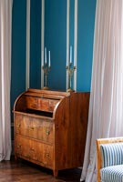 Antique cylinder bureau in classic bedroom  