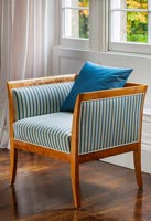 Antique chair with striped upholstery fabric