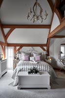 Modern bedroom with vaulted ceilings 