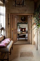 Country hallway with view into living room decorated for Christmas 