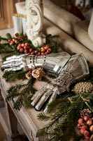 Armoured gloves on table with Christmas decorations 