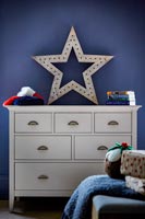 Star light on chest of drawers at Christmas 