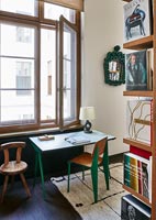 Green desk and chairs in retro study 
