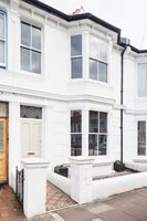 Exterior of classic white terraced house 