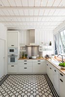 Patterned floor in white kitchen  