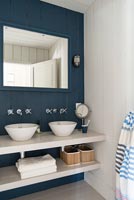 Blue and white modern country bathroom with double sinks 