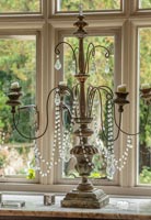 Wire and bead candelabra in window 
