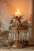 Ornate candle on mantelpiece 