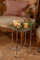 Ornate dining room chairs and candles 