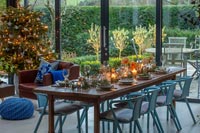 Modern dining room with view to garden - decorated for Christmas 