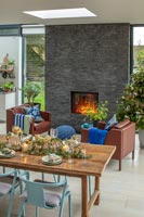 Slate fireplace in modern open plan space at Christmas 