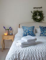 Christmas wreath above bed 