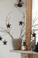 Branches and stars - Christmas decorations on mantelpiece 