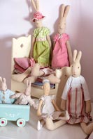 Collection of rabbit toys and wooden toy bed 