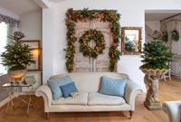 Double vintage doors decorated for Christmas in country living room 