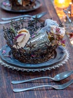 Decorative metal crown on place setting for Christmas dinner 